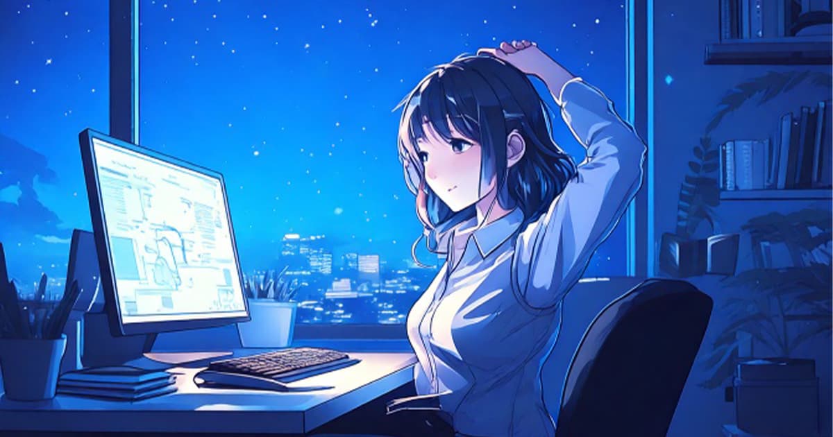 パソコンの前で背伸びしている女性